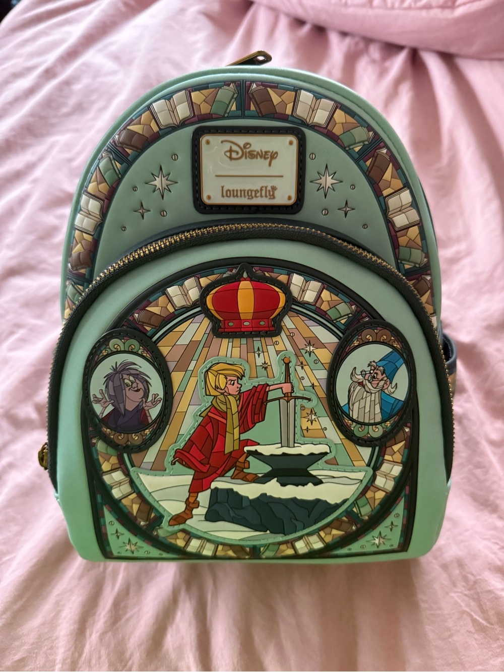 Loungefly Disney’s Sword in the Stone Stained Glass Backpack